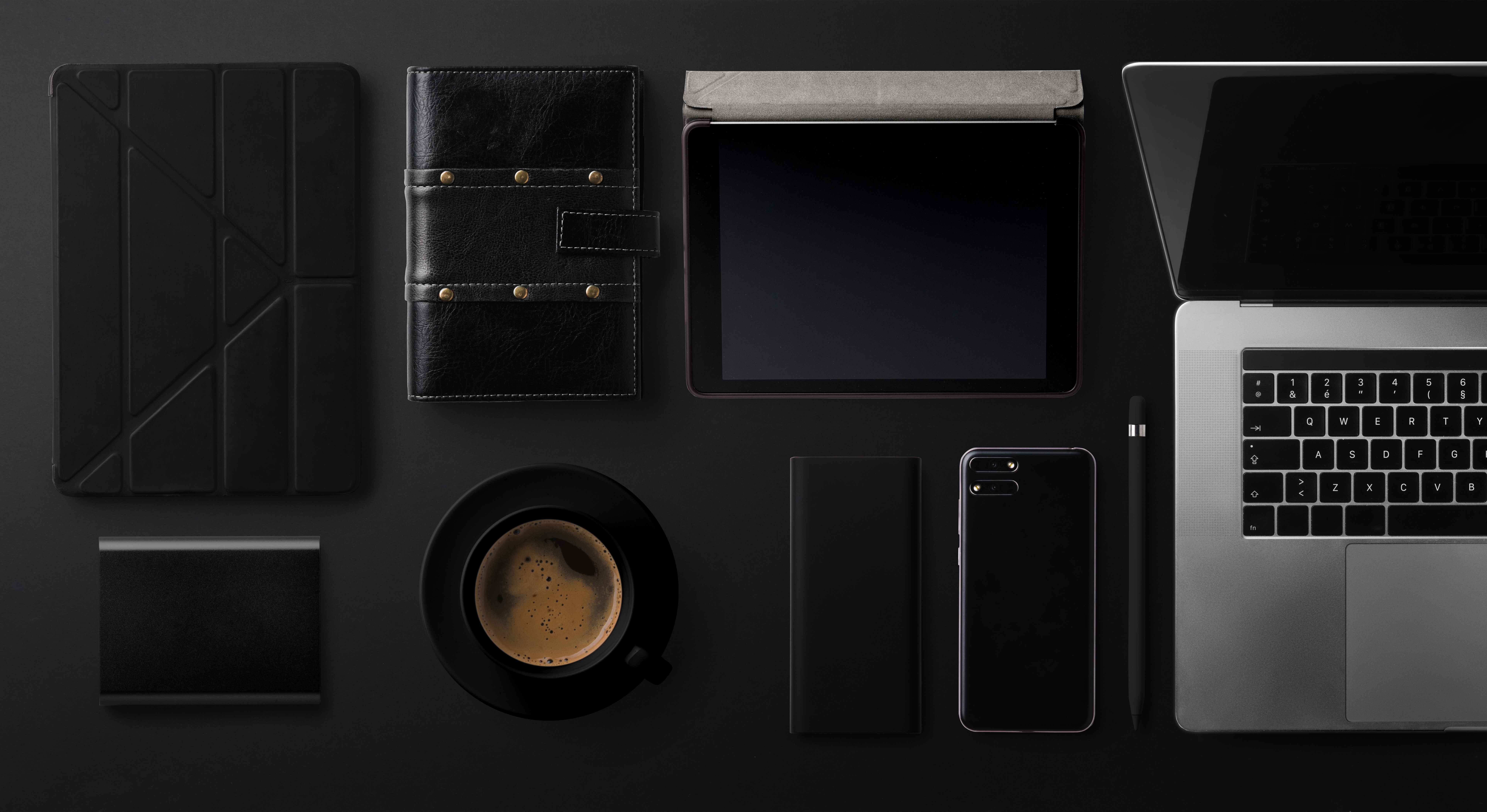 top view of Apple products , iphone , apple watch and ipad